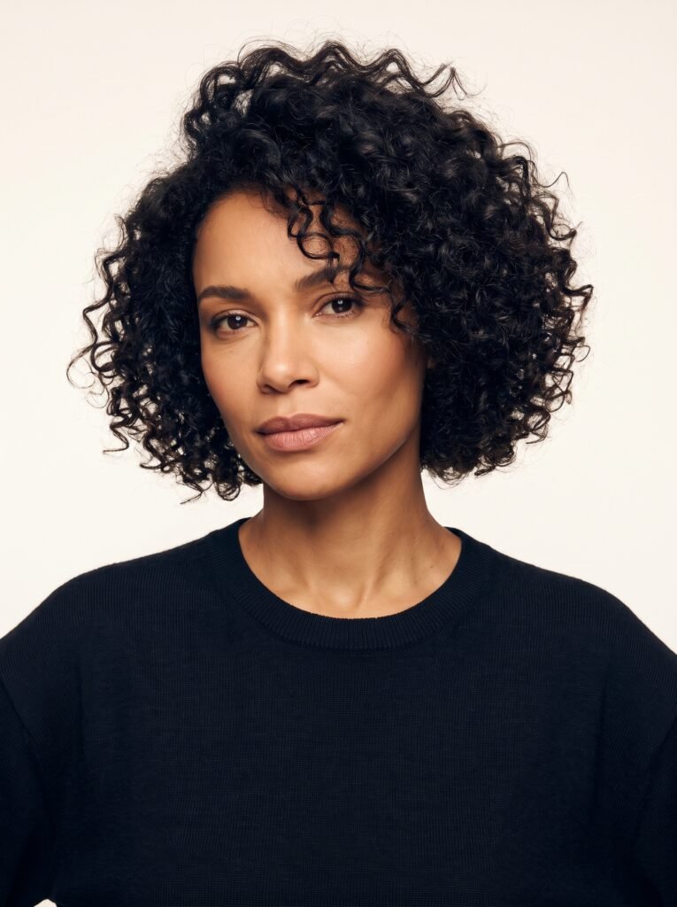 woman with voluminous curly bob 202607271356