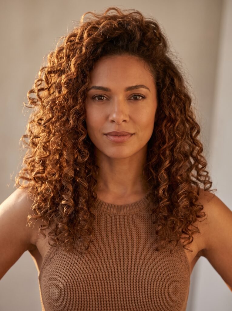 woman with voluminous long curly… 202607271419